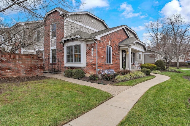 view of side of property with a lawn