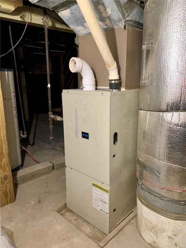 utility room featuring gas water heater