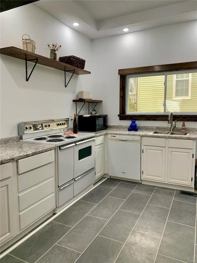 kitchen featuring a sink, recessed lighting, white appliances, white cabinetry, and open shelves