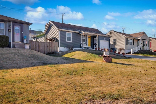 single story home with a garage and a front lawn