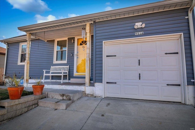 ranch-style house with covered porch and a garage