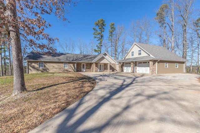 view of front of house with a front yard and a garage