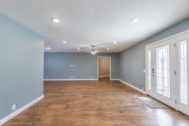 entryway with hardwood / wood-style flooring and ceiling fan