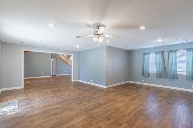 unfurnished room featuring dark hardwood / wood-style floors and ceiling fan