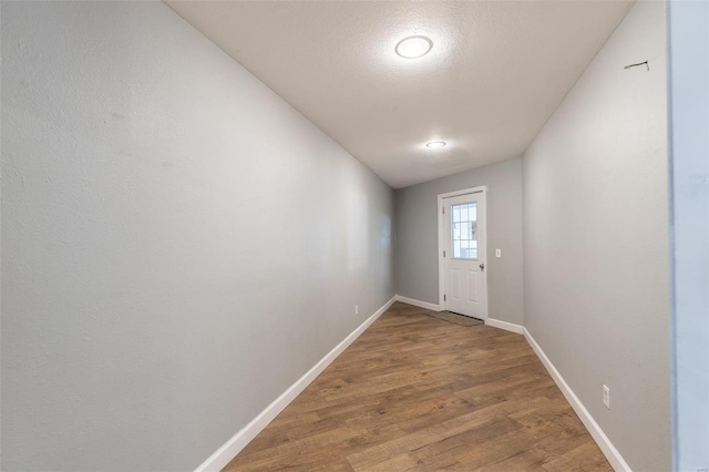 doorway to outside with hardwood / wood-style floors