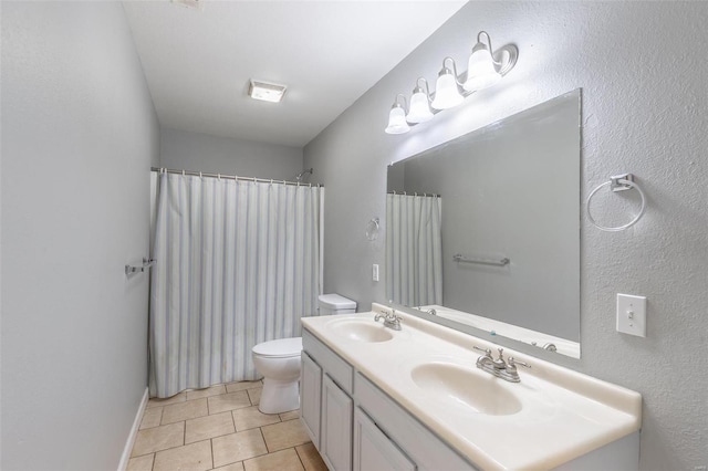 bathroom with toilet, vanity, tile patterned floors, and a shower with shower curtain