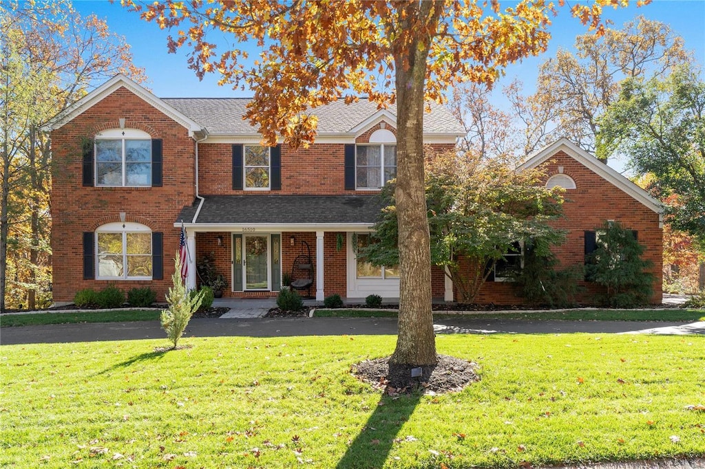 view of property with a front lawn