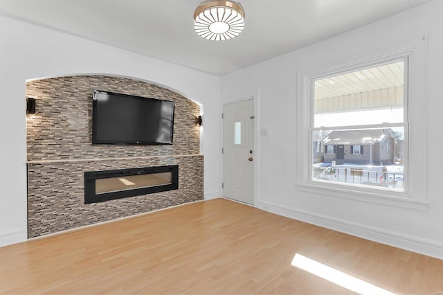 unfurnished living room featuring hardwood / wood-style flooring