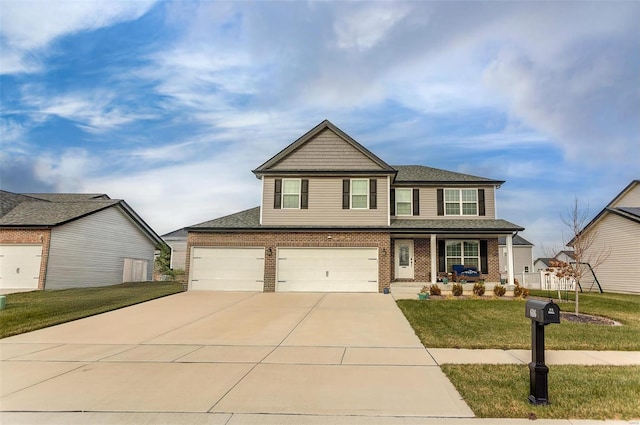 view of front of house with a garage and a front lawn