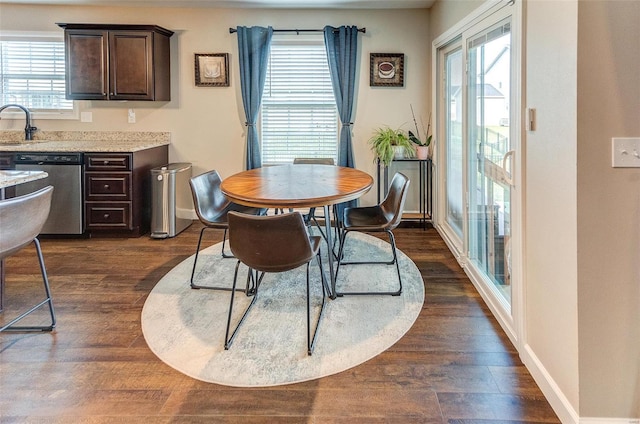 dining room featuring dark hardwood / wood-style floors and sink