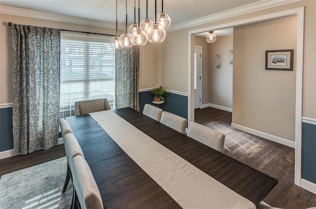 dining room with crown molding and dark wood-type flooring