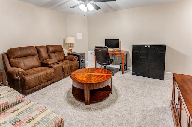 carpeted living room with ceiling fan