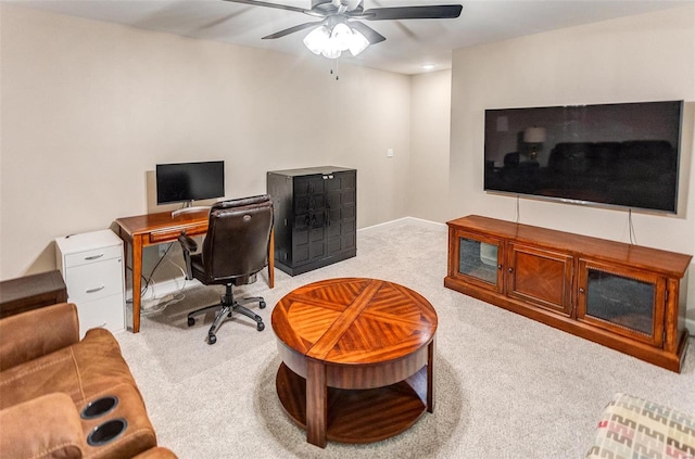 carpeted home office with ceiling fan