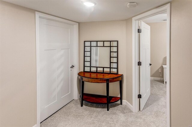 hallway with light carpet