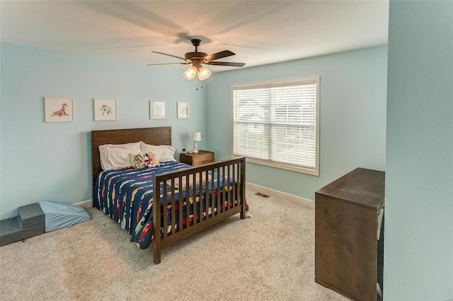 carpeted bedroom featuring ceiling fan