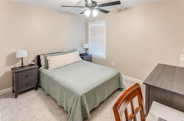 bedroom with ceiling fan and light colored carpet