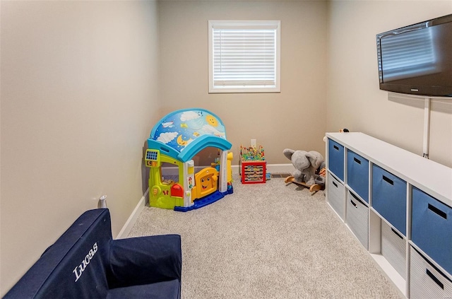 playroom featuring light colored carpet