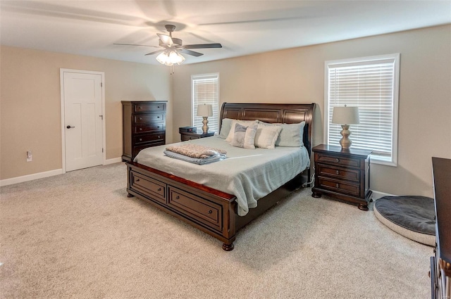 bedroom featuring light colored carpet and ceiling fan