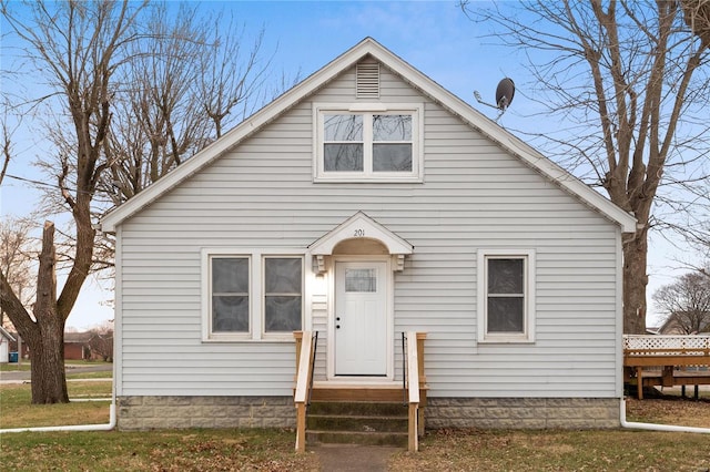 bungalow-style house with a front yard