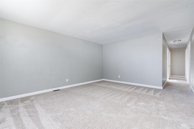 empty room featuring light colored carpet