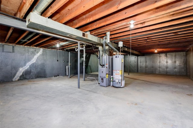 basement with heating unit and gas water heater