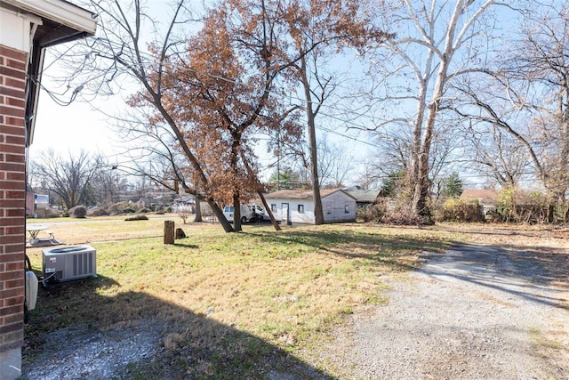 view of yard featuring central AC unit