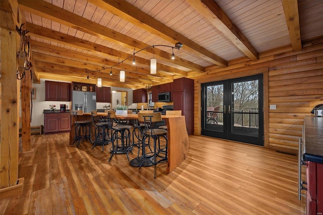 kitchen with french doors, stainless steel appliances, light hardwood / wood-style flooring, beamed ceiling, and wood ceiling