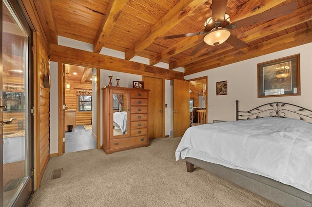 carpeted bedroom with ceiling fan, beam ceiling, and wooden ceiling