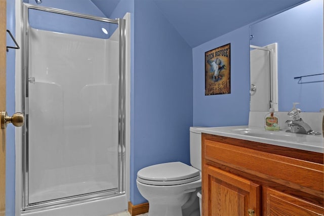 bathroom featuring toilet, vanity, lofted ceiling, and walk in shower