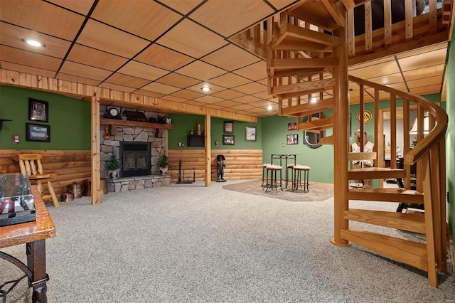 living room featuring carpet and a fireplace