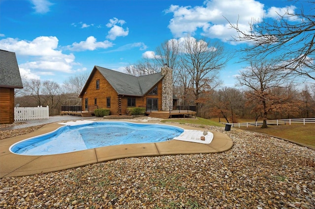 view of swimming pool featuring a deck