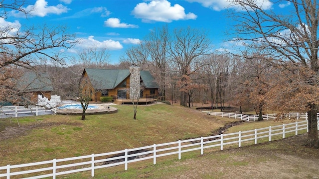 view of yard with a rural view and a deck