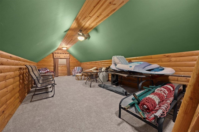 interior space featuring carpet, rustic walls, and lofted ceiling