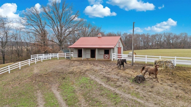 view of stable featuring a rural view