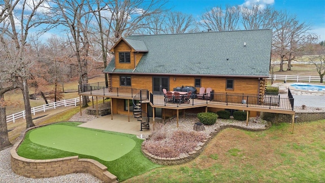 back of house with a patio area and a wooden deck