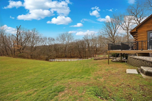 view of yard featuring a wooden deck