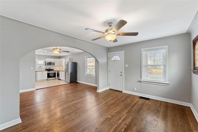 entrance foyer with hardwood / wood-style floors and ceiling fan