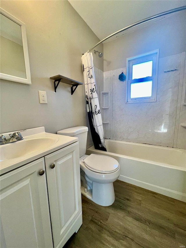 full bathroom with hardwood / wood-style floors, vanity, toilet, and shower / bath combo