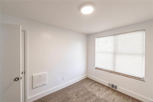 unfurnished room with carpet