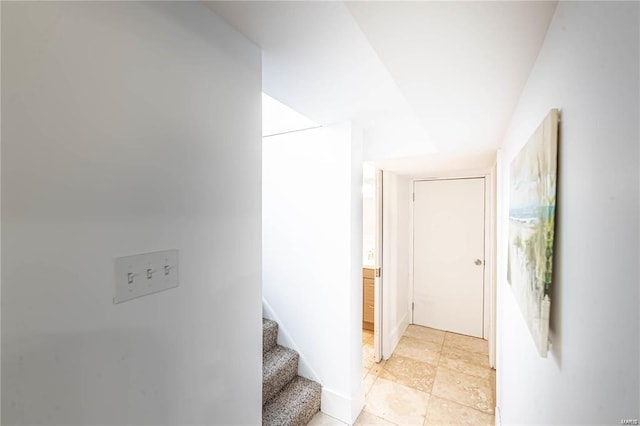 corridor featuring light tile patterned floors