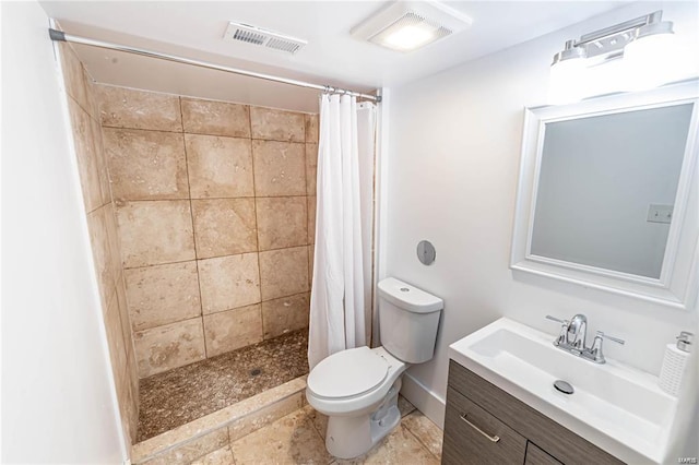 bathroom featuring a shower with curtain, vanity, and toilet