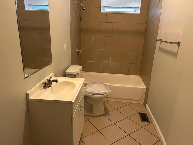 full bathroom with tile patterned floors, vanity, toilet, and tiled shower / bath combo