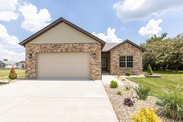 view of front facade with a front yard and a garage