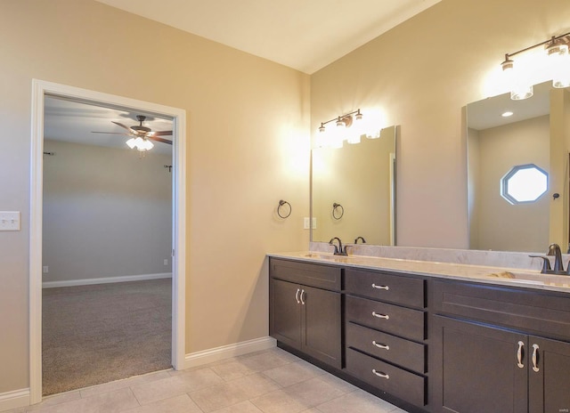 full bath with tile patterned floors, a sink, double vanity, baseboards, and ceiling fan