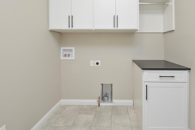 laundry area with cabinet space, hookup for an electric dryer, baseboards, and washer hookup