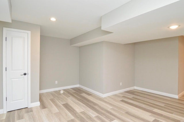 unfurnished room featuring recessed lighting, baseboards, and light wood-style floors