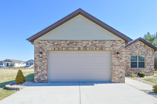 exterior space with brick siding, an attached garage, and concrete driveway