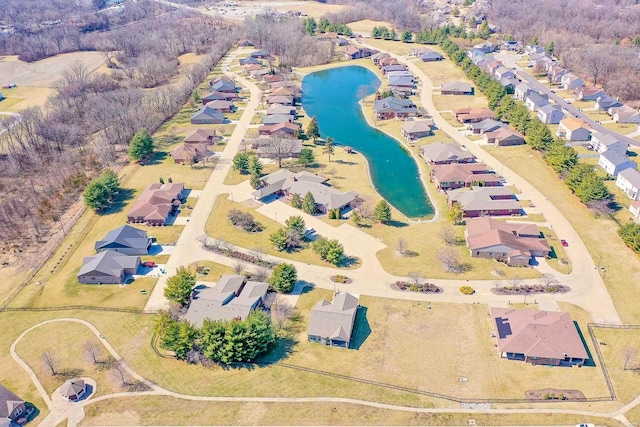 bird's eye view featuring a residential view and a water view