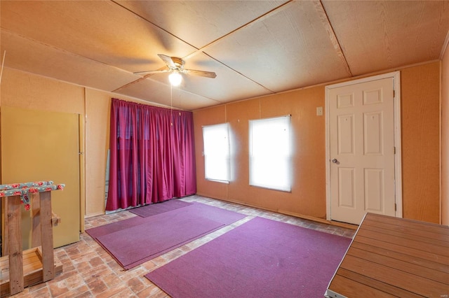 interior space featuring ceiling fan