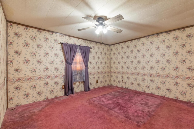 spare room with a textured ceiling, carpet floors, and ceiling fan